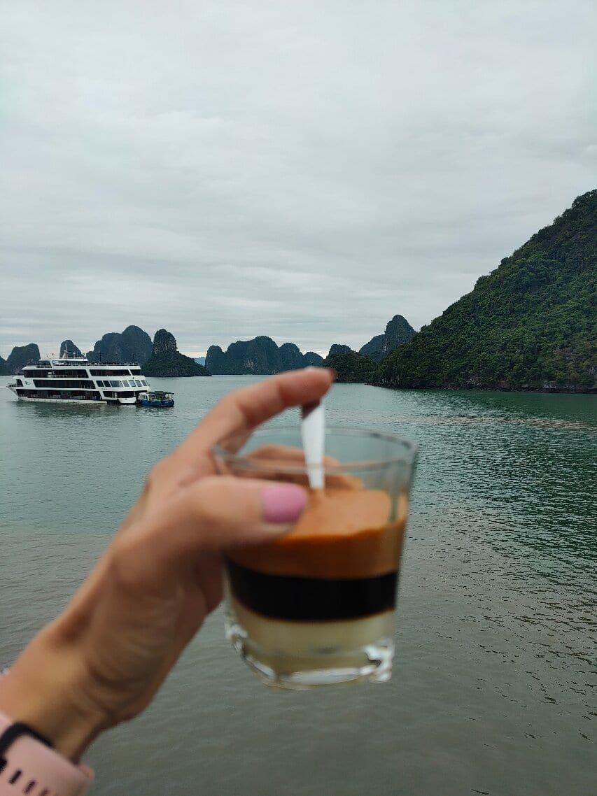 Vietnamese egg coffee on deck, looking out across Ha Long Bay