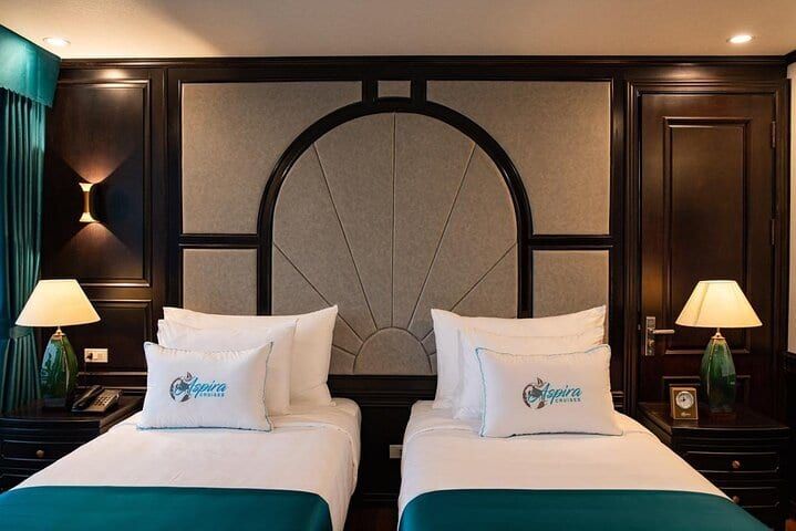 Twin beds made up with Aspira Cruise linen