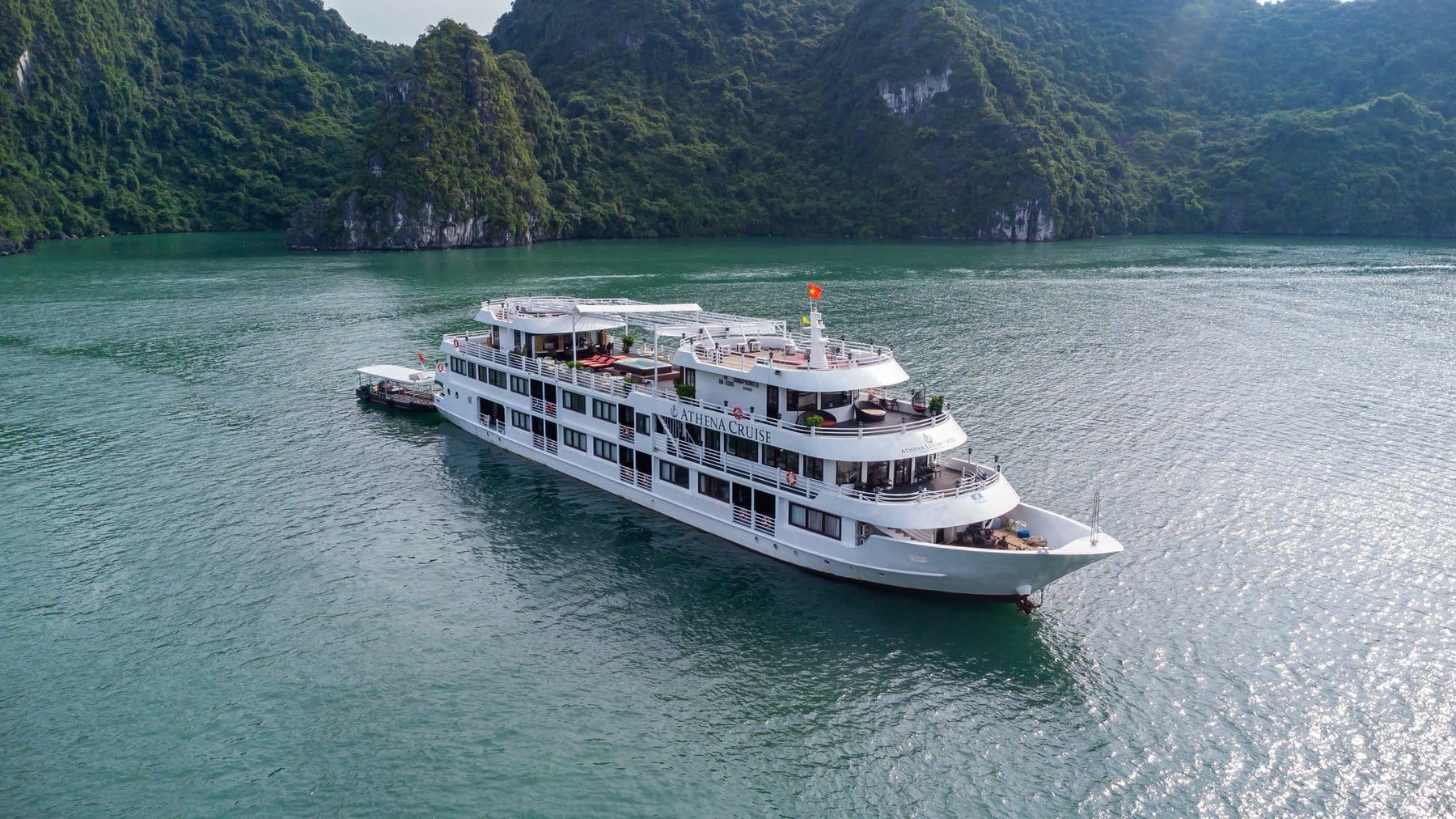 Athena Luxury Cruise under way on flat water in Ha Long Bay
