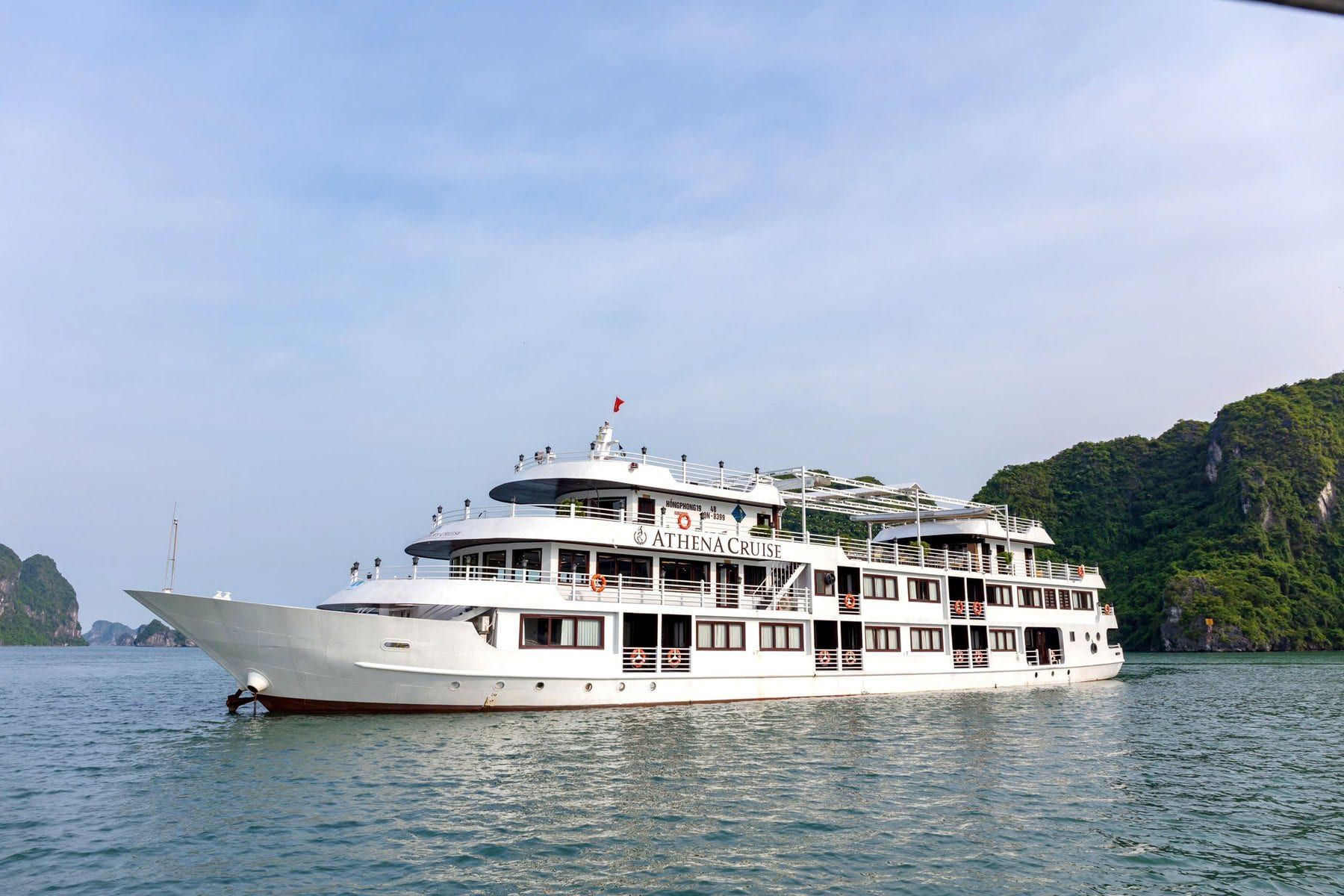 Athena Luxury Cruise at sunset in Ha Long Bay