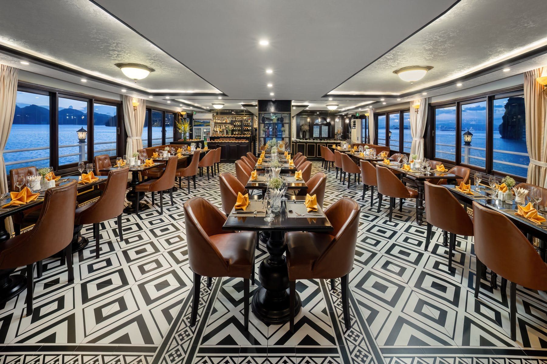 A restaurant laid for dinner aboard one of the fleet