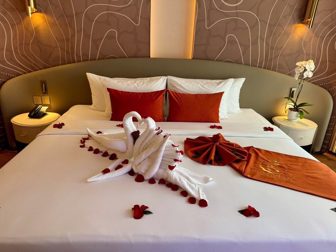 An Athena Premium cabin turned down with swan towel art and rose petals