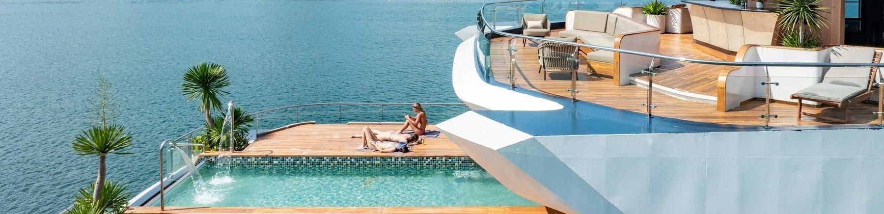 The pool terrace on Azura Cruise, teak decking running to the water
