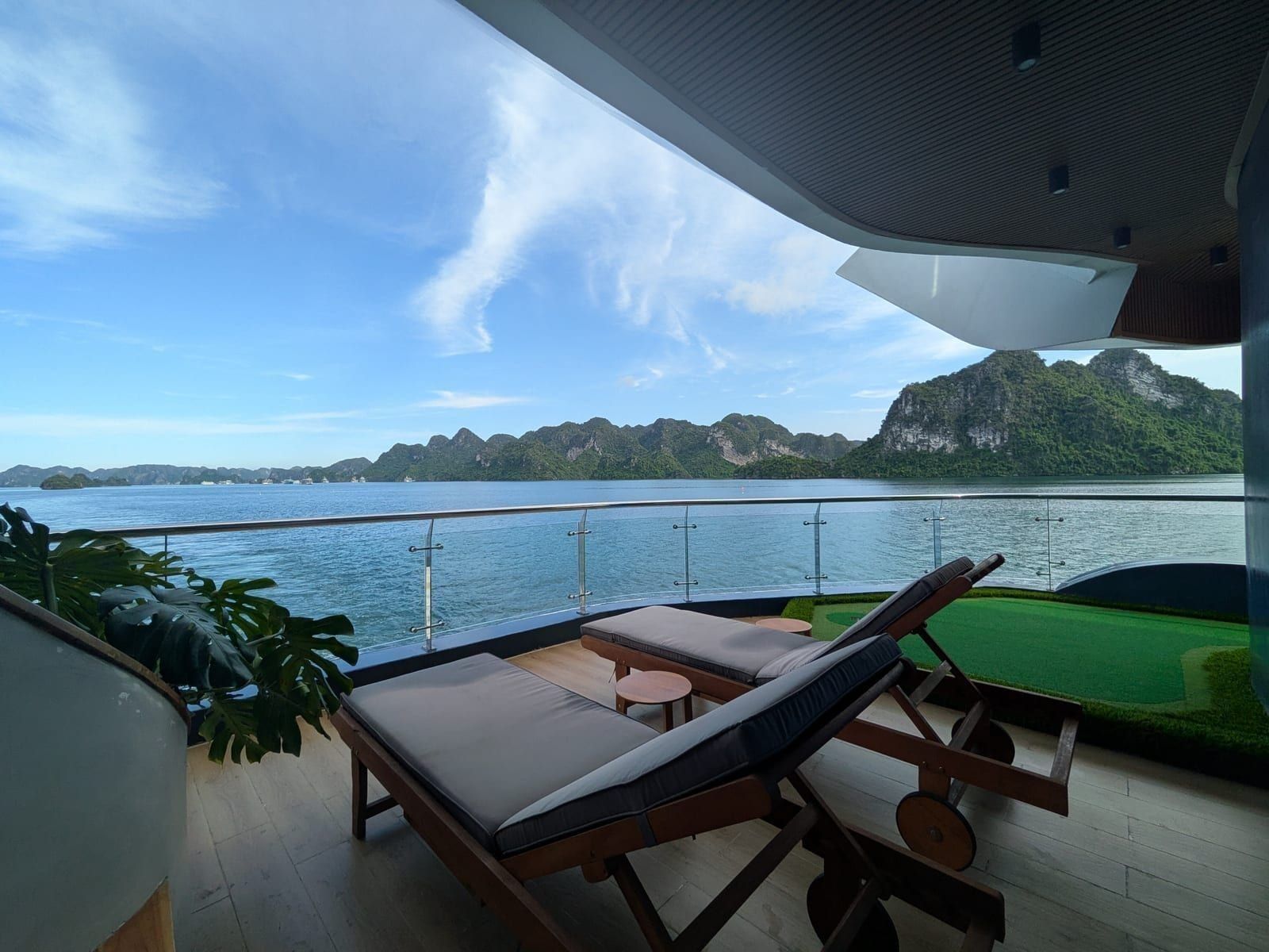 Loungers on a private Azura Cruise balcony above the bay