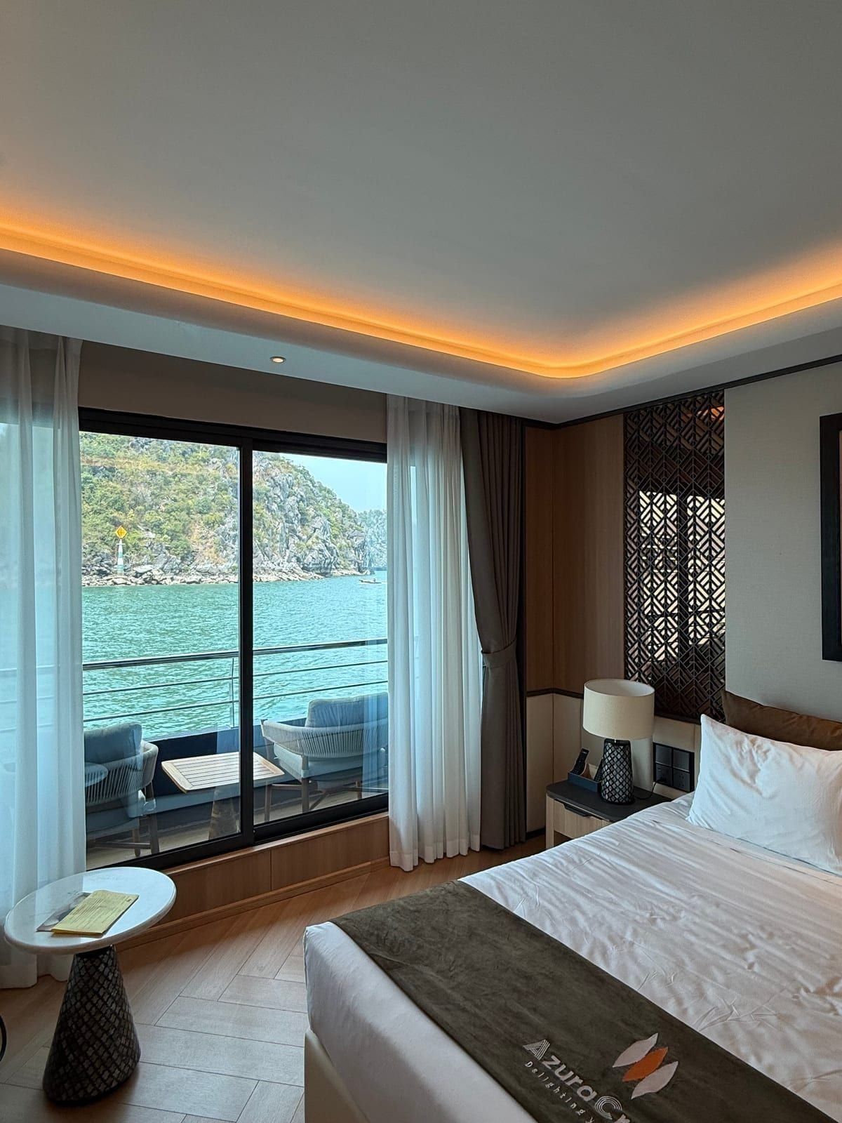 An Azura Cruise cabin opening onto its balcony
