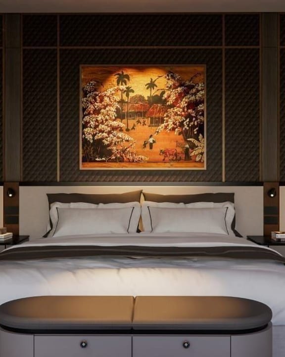 An Azura cabin in gold and dark lacquer with a framed painting